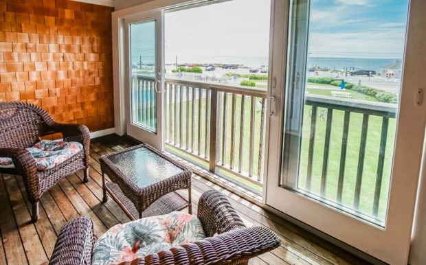 Photo of Living Room with sliding doors overlooking yard